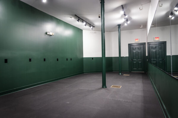 Interior image of a business with newly painted walls in green.