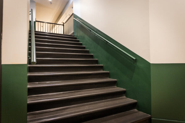 Interior image of a business with newly painted walls in green.